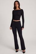 Pantalones acampanados de tiro medio de modal en negro