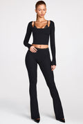 Pantalones de tiro medio acampanados de modal en negro